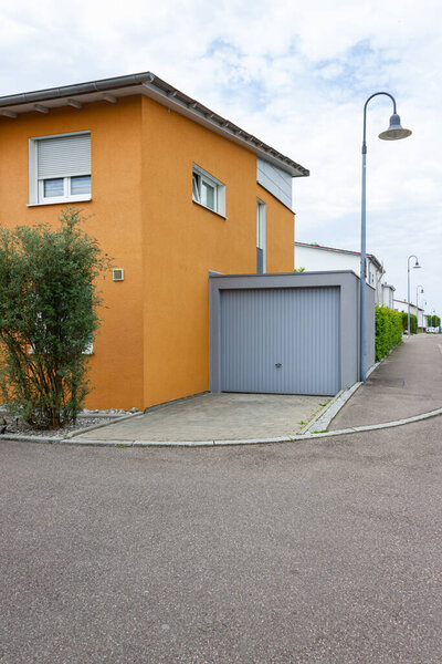 garage next to new building in south germany countryside at springtime