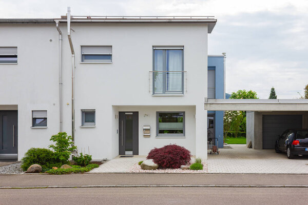 house entrance of new modern building in germany springtime
