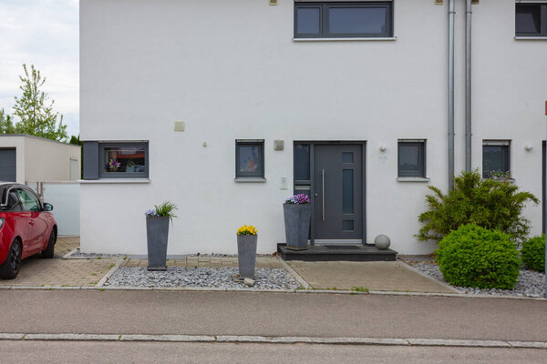 house entrance of new modern building in germany springtime