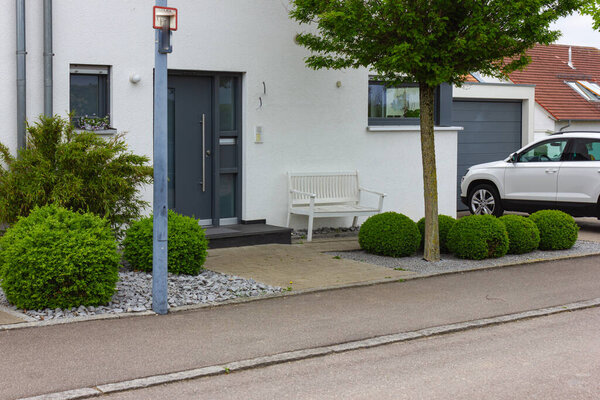 house entrance of new modern building in germany springtime