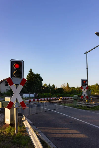Railroad Crossing With Red Light In Southern Germany Traffic Street Stock Photo