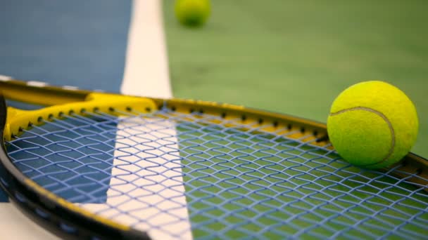 Close up of tennis equipment on the court. Sport, recreation concept. — Stock Video