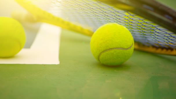 Close up of tennis equipment on the court. Sport, recreation concept. — Stock Video