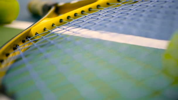 Close up of tennis equipment on the court. Sport, recreation concept. — Stock Video