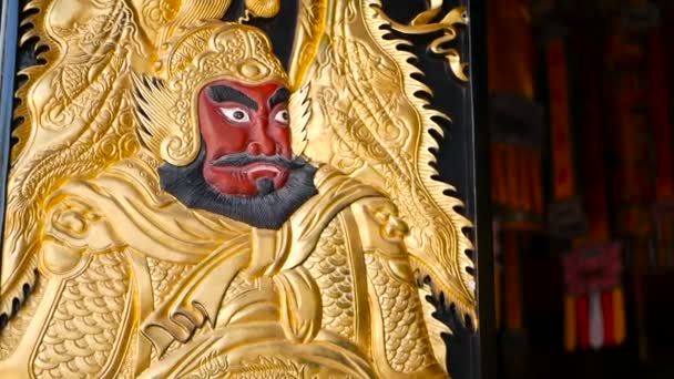 Wooden gates decorated with traditional chinese ancient holy door gods guardians Qin Shubao and Yuchi Jingde Gong — Stock Video