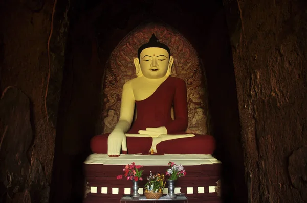 BAGAN, MYANMAR - NOVEMBER 18, 2015: Huge colored statue of Buddha in temple, From below shot of colorful Buddha statue in ornamental temple. Mingalazedi Sulamani Shwezigon Ananda Htilominlo
