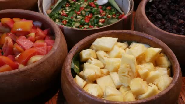 Top view of selection of various platters with delicious asian food and spices on a street market stall in Bangkok, Thailand. — Stock Video