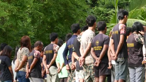 ANG THONG MARINE PARK, THAILAND - 9 JUNE 2019: Group of thai men attending morning muster while working as rangers and protecting national park. Concept of environment and nature conservation in Asia — Stock Video