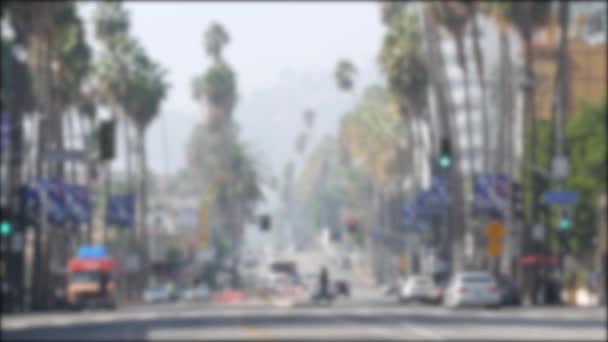 Walk of fame promenade, Los Angeles, Hollywood boulevard, California, USA. Pedastrians walking on on crossroad of streets. Entertainment and cinema industry iconic tourist landmark. Palms in LA city — Stock Video