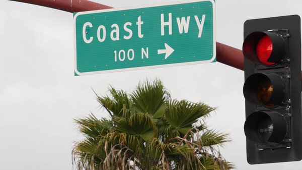 Pacific Coast Highway, historic route 101 road sign, tourist destination in California USA. Lettering on intersection signpost. Symbol of summertime travel along the ocean. All-American scenic hwy.