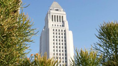 LOS ANGELES, CALIFORNIA, USA - 30 OCT 2019: City Hall highrise building exterior in Grand Park. Mayor's office in downtown. Municipal civic center, federal authority, headquarters of government in LA. clipart