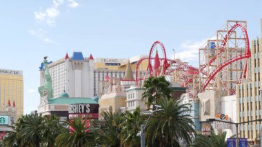 LAS VEGAS, NEVADA USA - 7 MAR 2020: The Strip boulevard with luxury casino and hotels in gambling sin city. Road to Fremont street in tourist money playing resort. New York-New York and roller coaster clipart