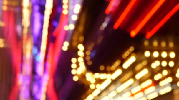 Defocused old fasioned electric lamps glowing at night. Abstract close up of blurred retro casino decoration shimmering, Las Vegas USA. Illuminated vintage style bulbs glittering on Freemont street — Stock Video