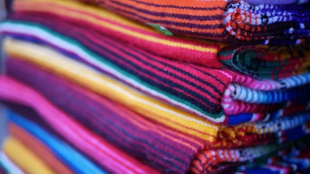 Colorful mexican wool serape blankets texture. Woven ornamental vivid textile with authentic latin american pattern. Striped multi colored fabric for poncho and sombrero. Hispanic indigenous style — Stock Video