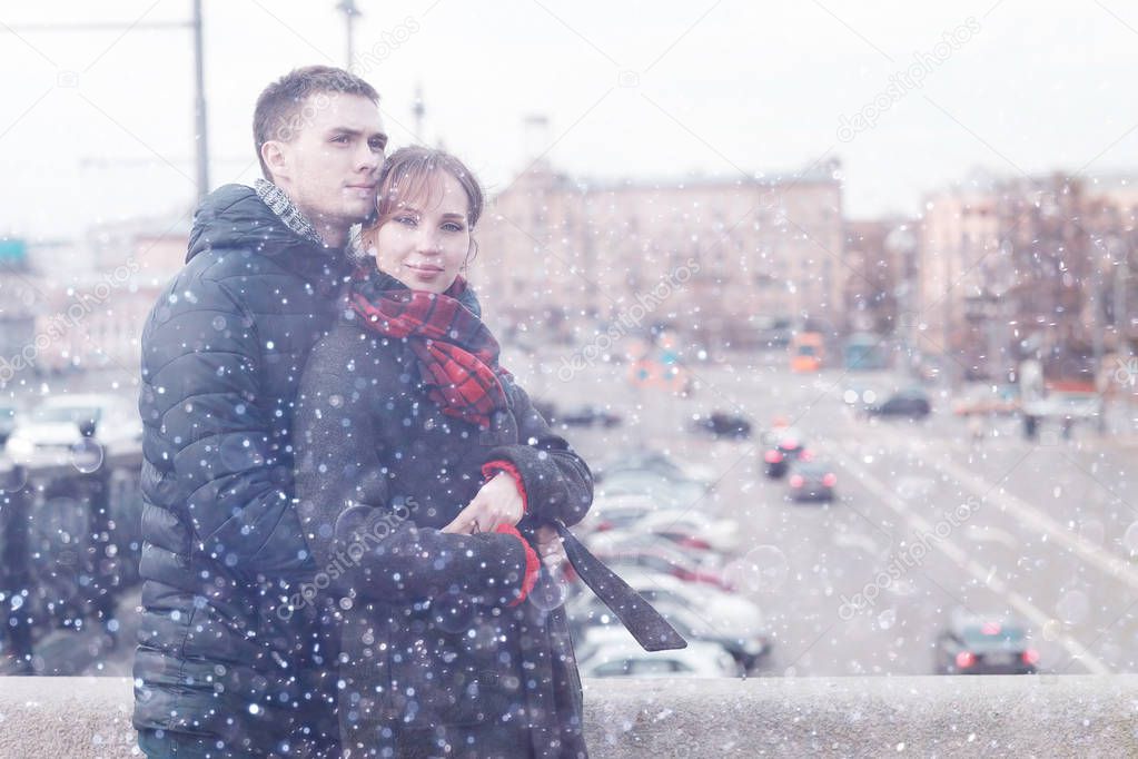 young love couple in winter city street 