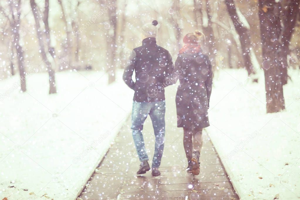 young man and woman walking in autumn city, romantic happy couple 