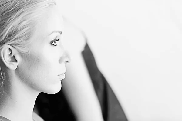 studio portrait of professional mode, attractive young woman with beautiful make-up