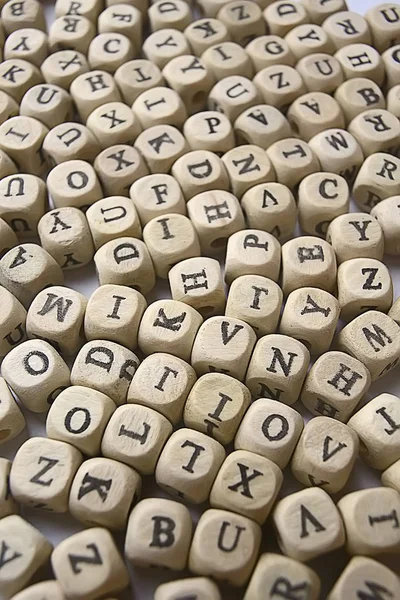 background of wooden cubes with alphabet letters, concept of education and reading, learning letters