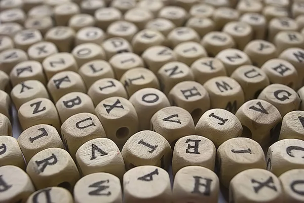 background of wooden cubes with alphabet letters, concept of education and reading, learning letters