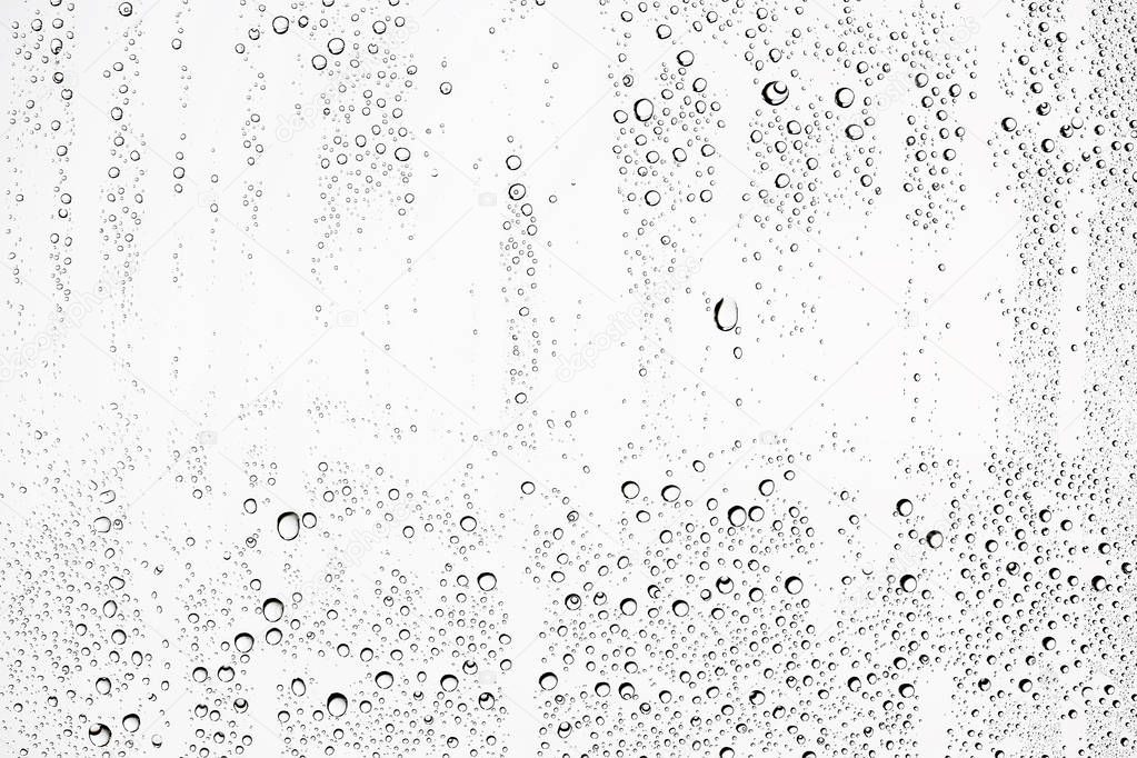 white wet background, raindrops on window glass, concept of autumn weather