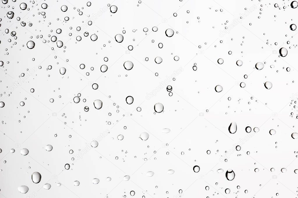 white wet background, raindrops on window glass, concept of autumn weather