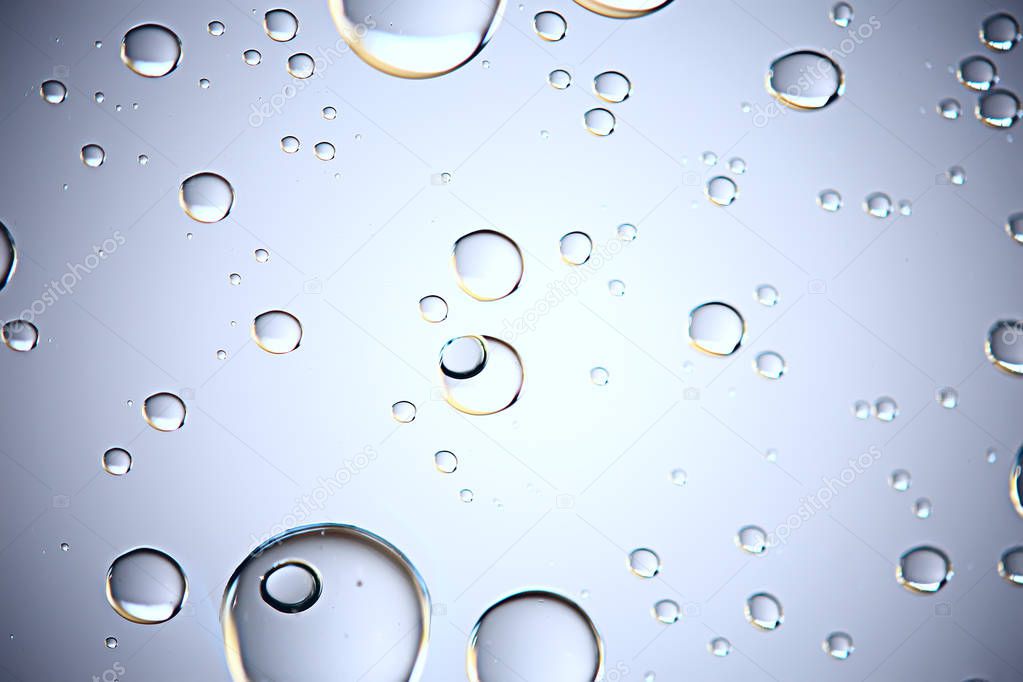 gray wet background, raindrops on window glass, concept of autumn weather
