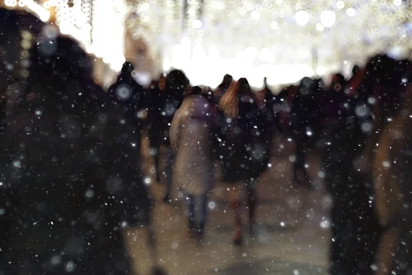 crowd of people on winter city street