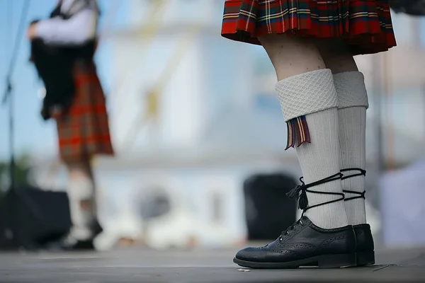 feet in Scottish skirts, the Scottish National Orchestra plays on St. Patrick\'s Day, holiday costumes for men