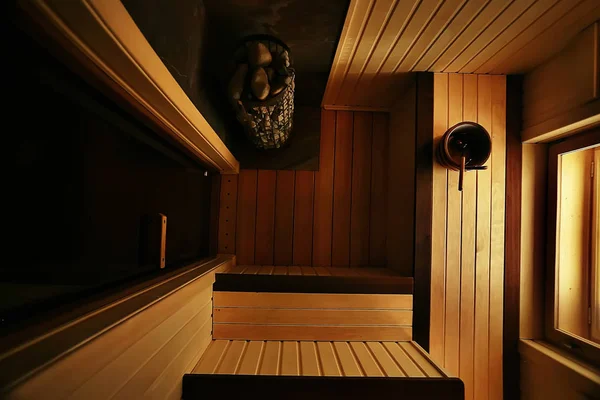 sauna, wooden interior baths, wooden benches and loungers accessories for sauna, spa complex in the hotel