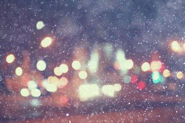 Světla Měst Sníh Rozmazané Panoráma Sezónní Pozadí Zasněžené Zimní Počasí — Stock fotografie