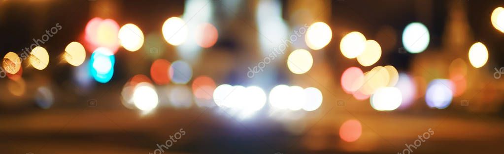 blurred bokeh city background, glare and glowing lights in night city 