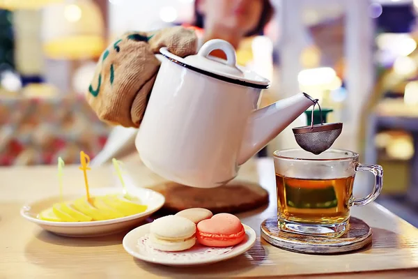 English tea in cafe, cup and kettle with five o\'clock tea