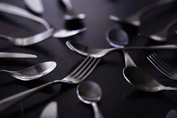 forks, spoons and knives on table, beautiful serving tableware