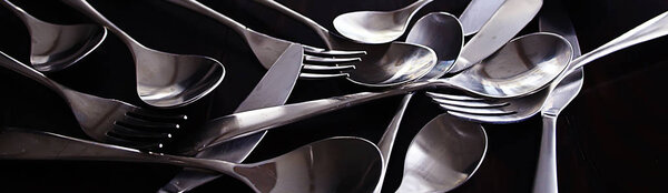 forks, spoons and knives on table, beautiful serving tableware 