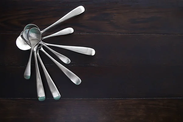 spoons on wooden table, beautiful serving tableware