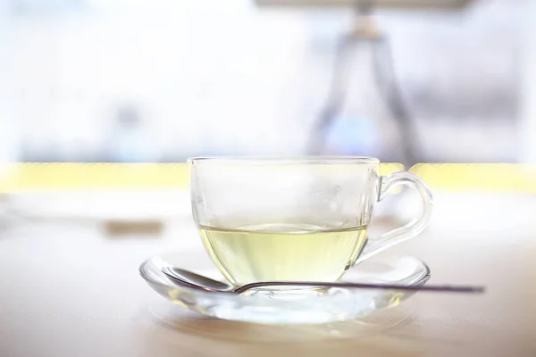 English tea in cafe, cup and kettle with five o\'clock tea