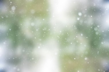 bulanık kar / soyut kış arka plan, arka bulanık parlayan yaprak plan üzerinde kar taneleri