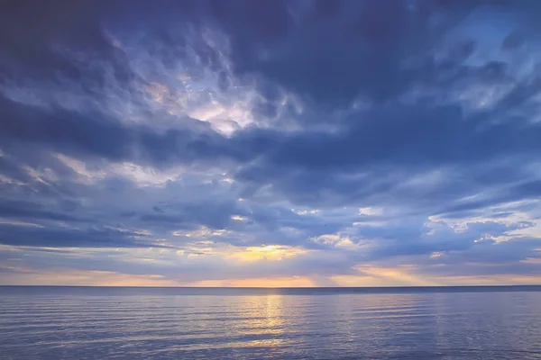 sky above water / texture background, horizon sky with clouds on the lake