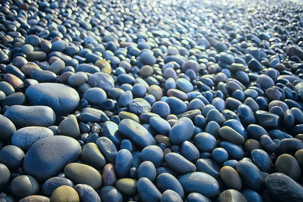 colored stones round the sea / texture wet rounded stones, wet multi-colored summer background