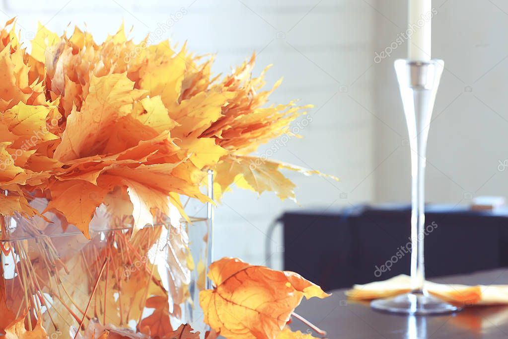yellow leaves in a vase / autumn bouquet of maple leaves, autumn scenery at home, autumn view