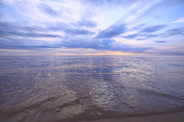 sky above water / texture background, horizon sky with clouds on the lake