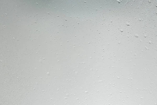 ıslak cam arka plan yoğunlaşır / soyut yağmur, şeffaf cam üzerine doku damlatır