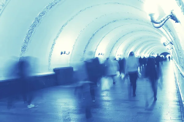 blurred background metro escalator / light blue background movement city infrastructure subway