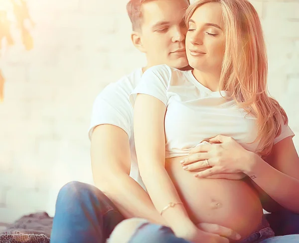 big belly pregnancy man kisses / family and childbirth, concept of family happiness and love, man and woman