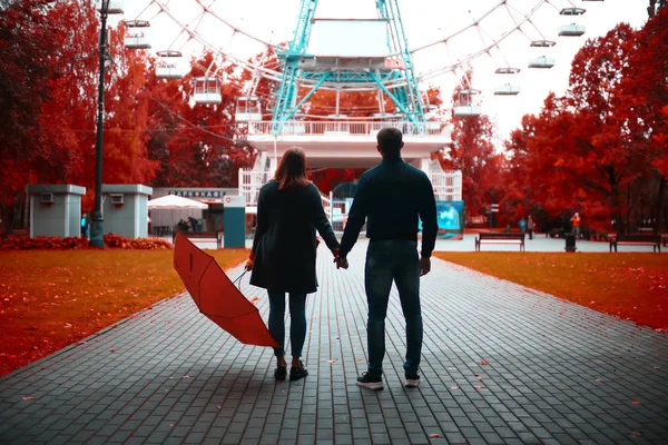 autumn view, people in the park on the background of autumn trees / beautiful autumn concept weather fall