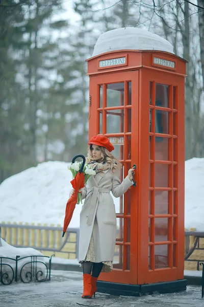 england red phone booth spring girl / london walk portrait englishwoman tourism in britain