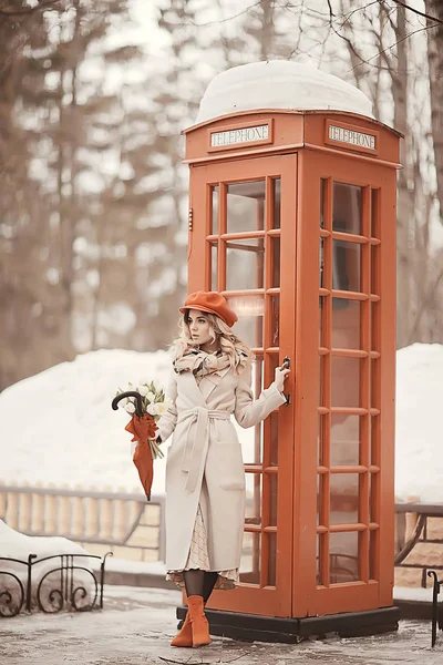 england red phone booth spring girl / london walk portrait englishwoman tourism in britain