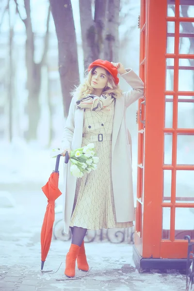 england red phone booth spring girl / london walk portrait englishwoman tourism in britain