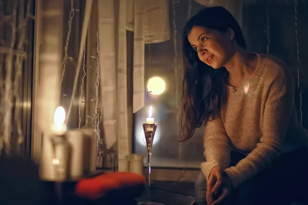 cozy Christmas evening girl / home New Year evening, model in a cozy house, evening light