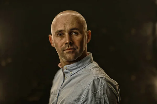 young bald guy portrait in studio